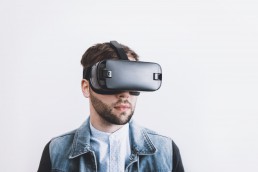 Bearded man wearing virtual reality headset