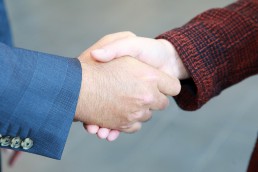 Close up of a man and woman shaking hands