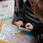 Two women looking at a map of Sailortown in Belfast
