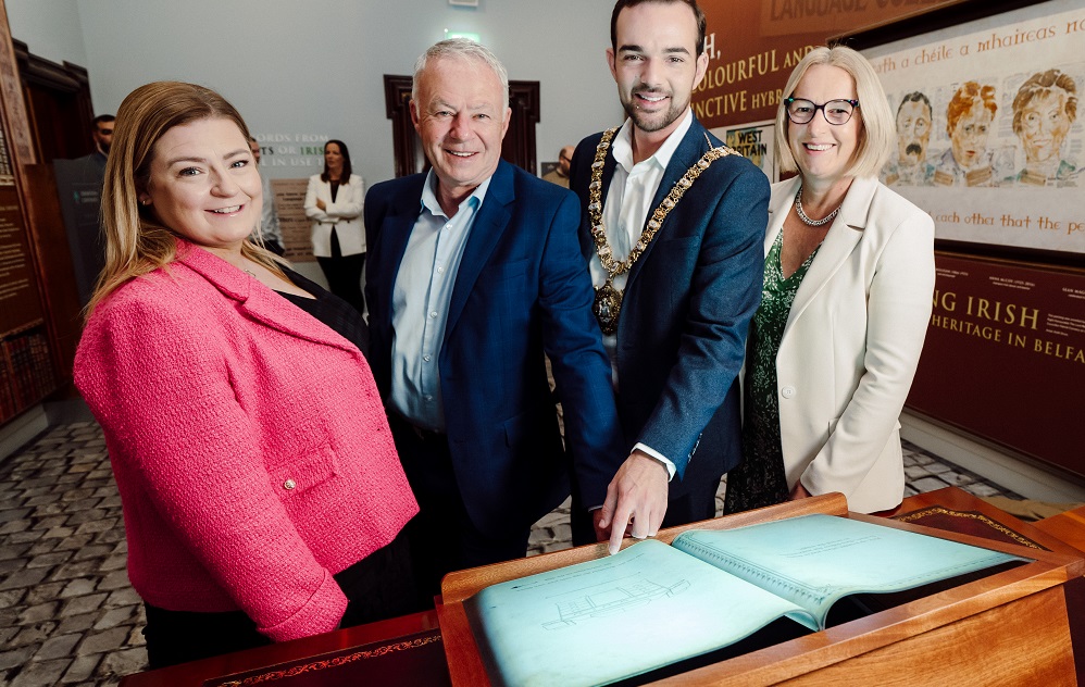 (L-R) Nora Largey, City Solicitor / Director of Legal and Civic Services, Belfast City Council, Janet Burns, Business Development Director, BT in Northern Ireland, Belfast Lord Mayor Councillor Micky Murray, and John Walsh, Chief Executive, Belfast City Council in front of an interactive digital book as part of the AR experience.